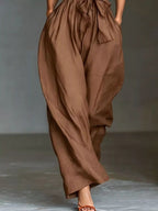 Halter Neck Wide-Leg Jumpsuit with Waist-Tie Detail - Dressed.