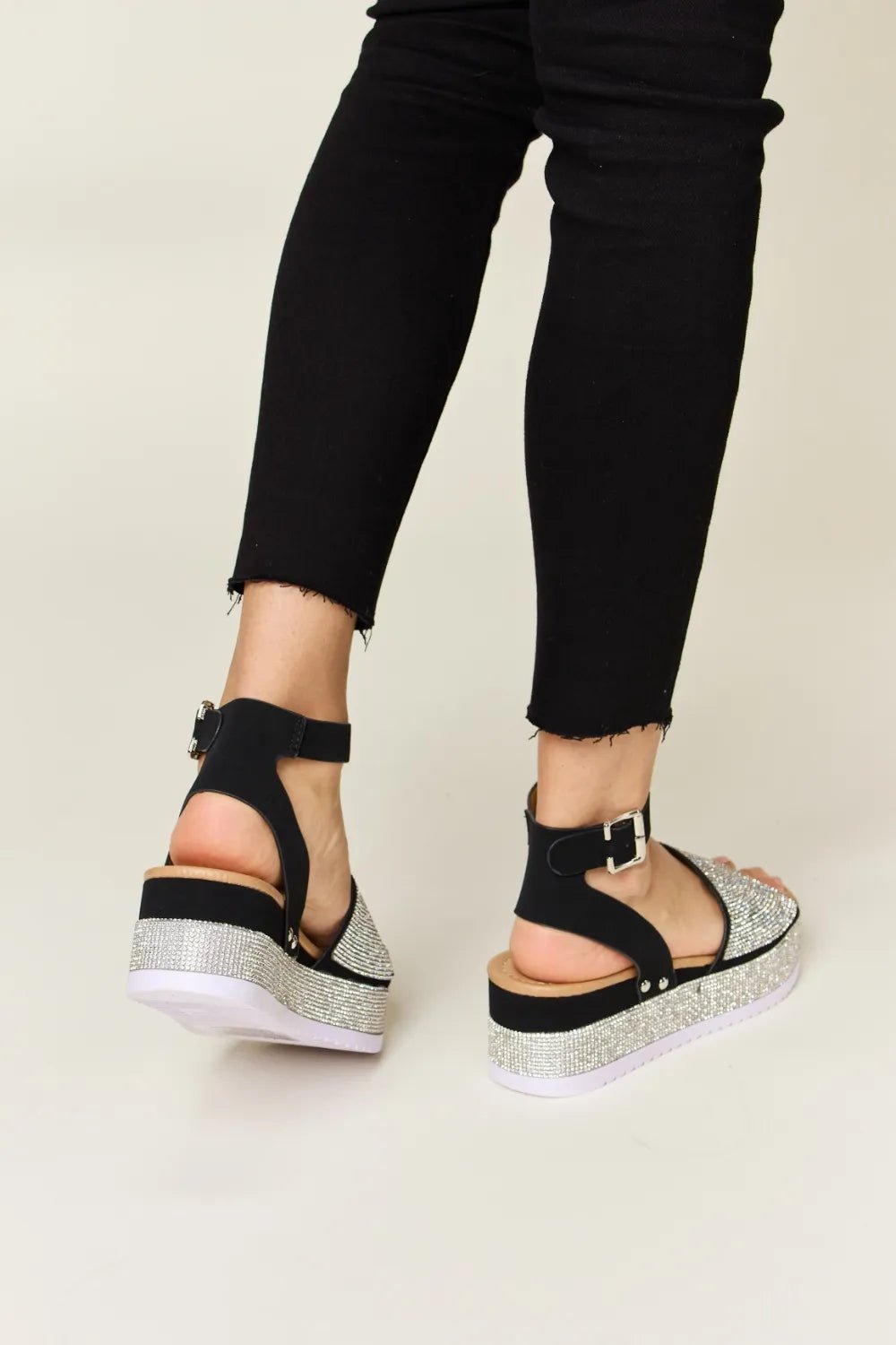 Noelle Rhinestone-Buckle Wedge Sandals — Black - Dressed.