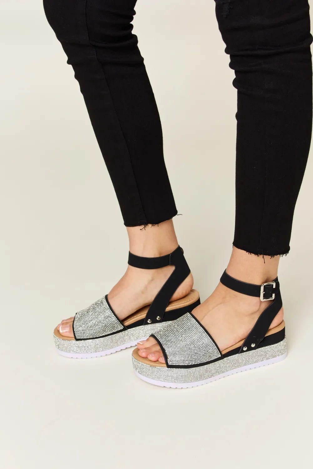 Noelle Rhinestone-Buckle Wedge Sandals — Black - Dressed.