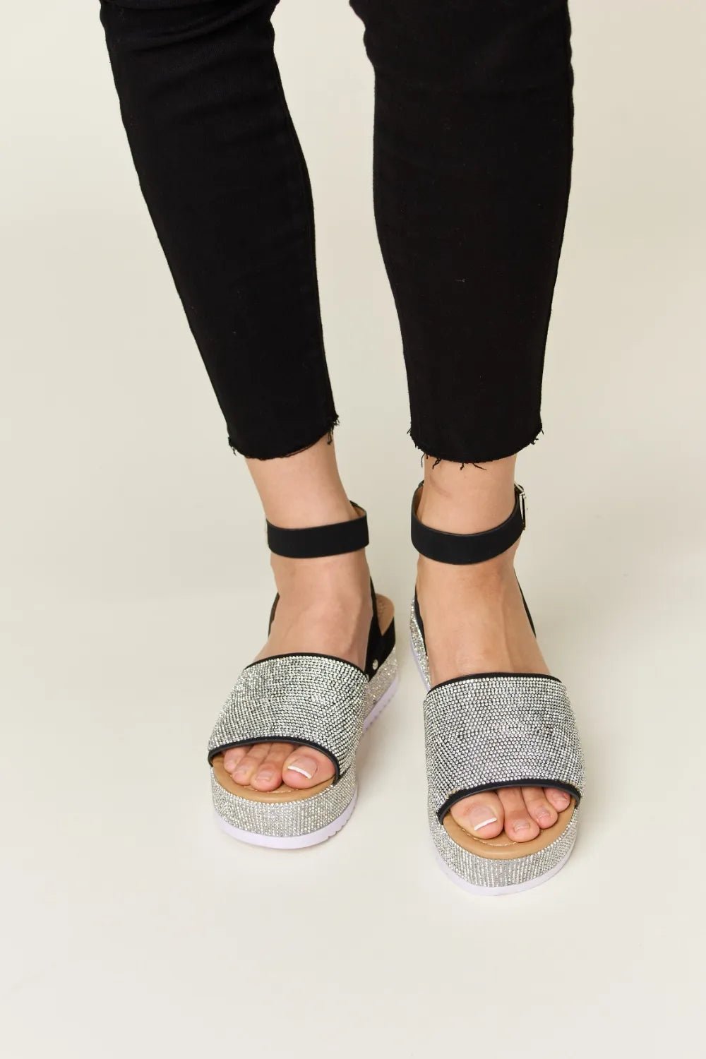 Noelle Rhinestone-Buckle Wedge Sandals — Black - Dressed.