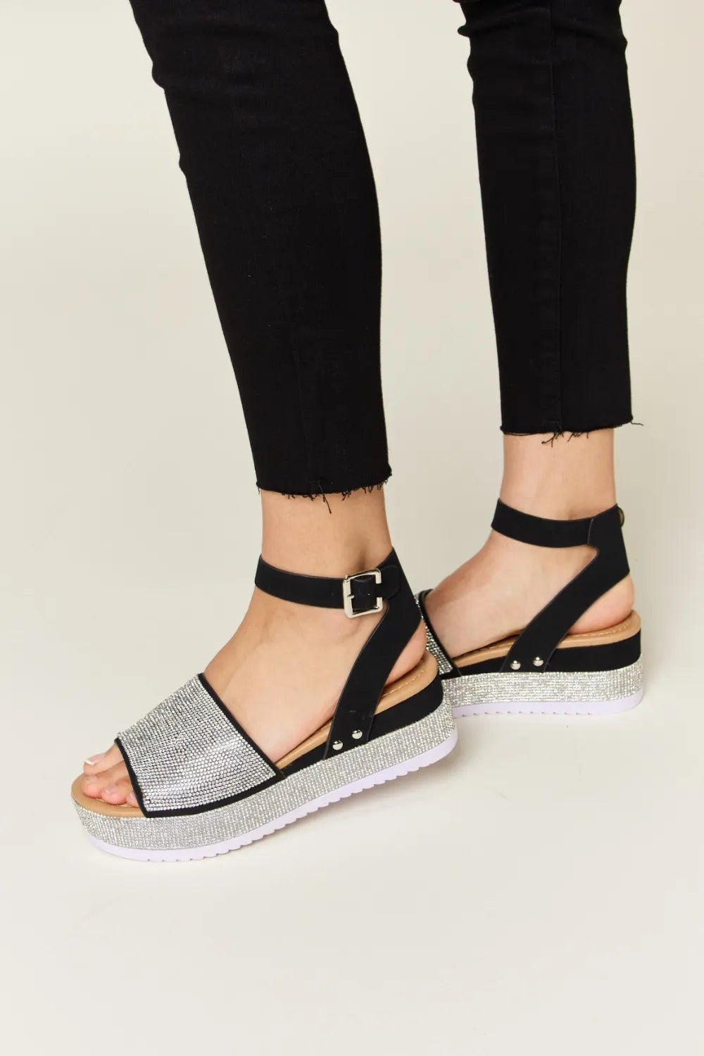 Noelle Rhinestone-Buckle Wedge Sandals — Black - Dressed.